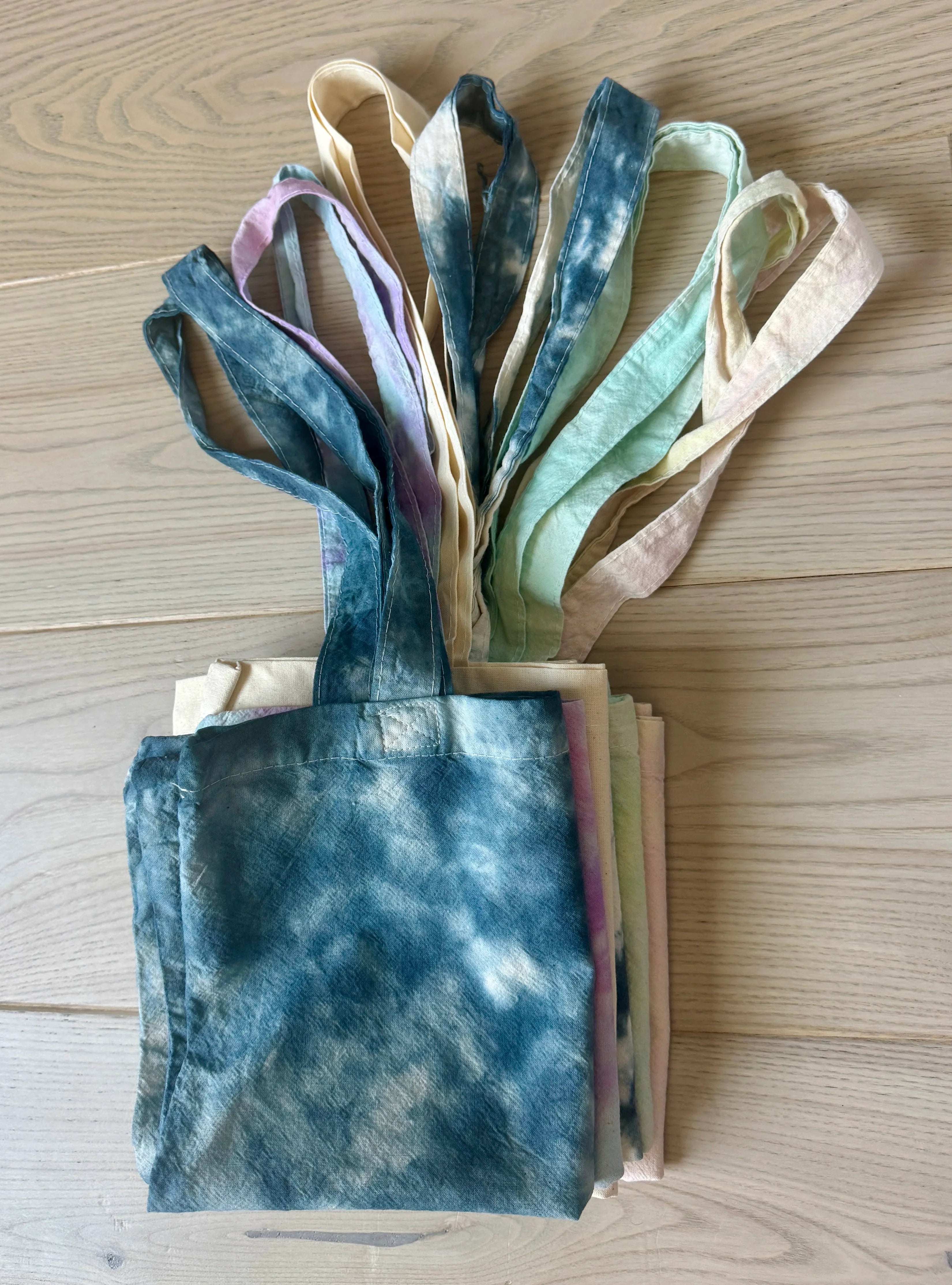 The Companion Tote Bag Folded Multiple Tie-Dye Colors